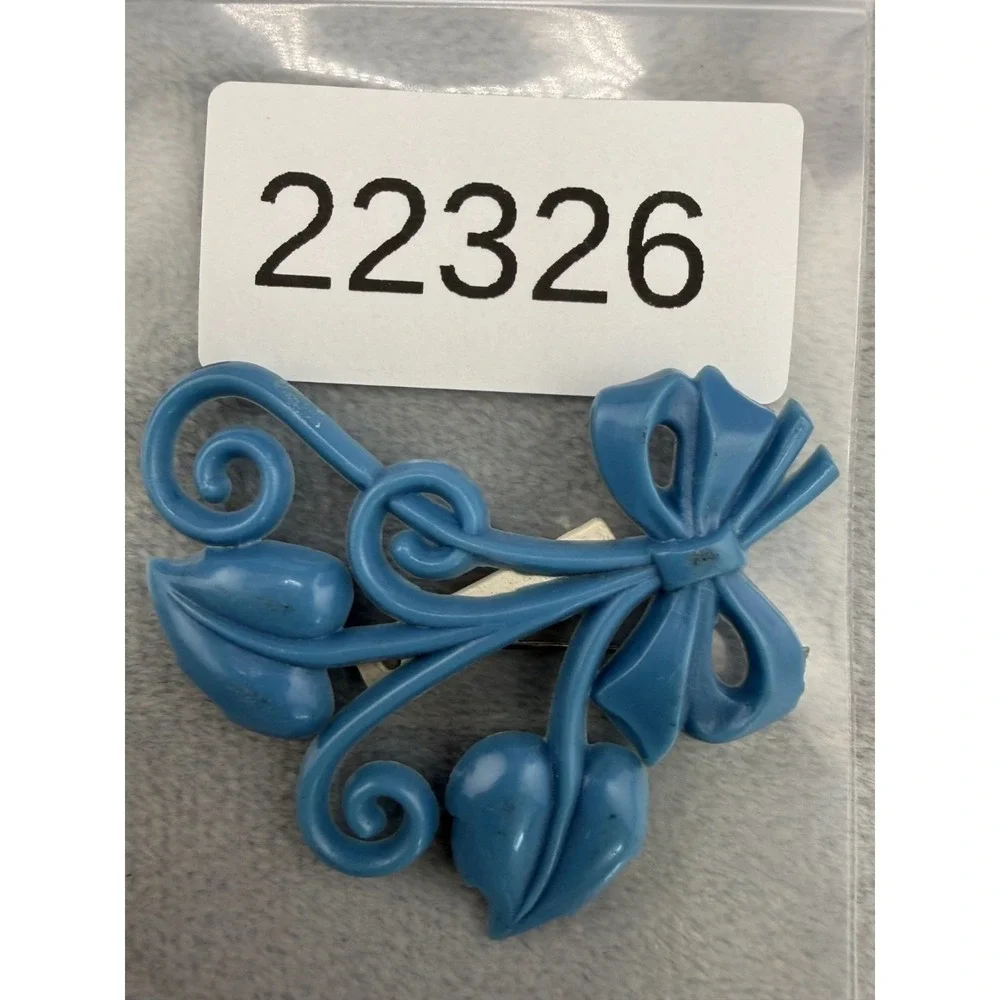 Vintage Brooch Light‎ Blue Molded Celluloid Bow